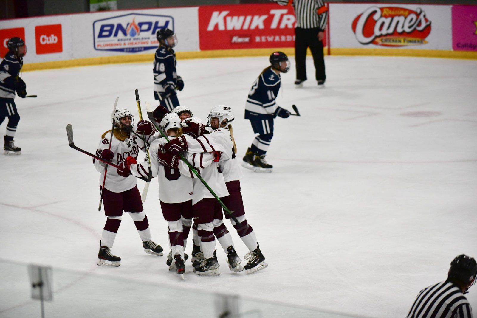 Packers players hugging after a goal